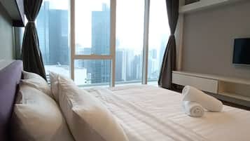 Family Apartment, 2 Bedrooms, Kitchenette, City View | In-room safe, desk, laptop workspace, soundproofing