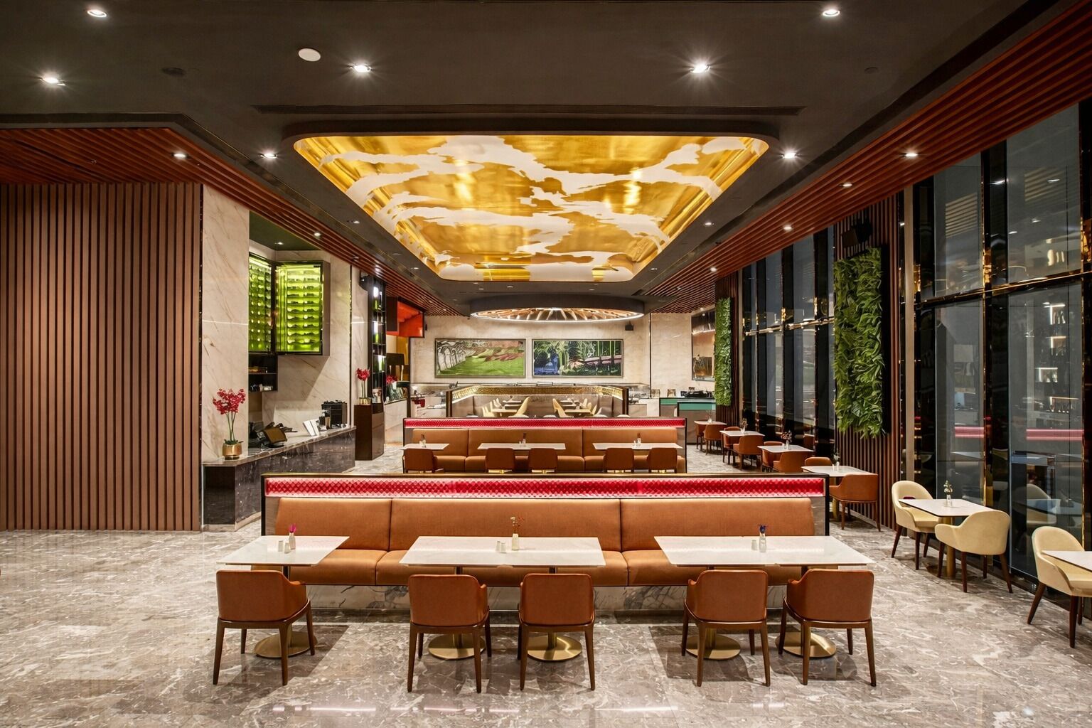 A spacious restaurant with high ceilings, a central seating area, and a modern design.