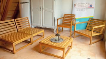 Basic Triple Room, 1 Bedroom | Living area | 60-cm flat-screen TV with cable channels