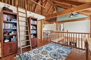 Experience the open and airy atmosphere of this spacious room with high ceilings and a rustic charm.