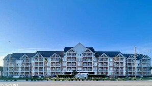 A multi-story hotel with a symmetrical facade, balconies, and a central entrance. - Break 4 Control
 (Gulf Shores)