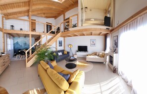 Smart TV, fireplace, books, stereo