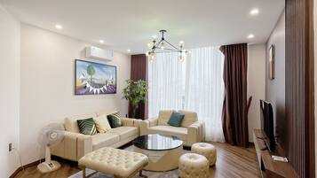 Apartment, 4 Bedrooms, City View | Living area | 40-inch flat-screen TV with cable channels