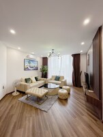 Apartment, 4 Bedrooms, City View | Living area | 40-inch flat-screen TV with cable channels