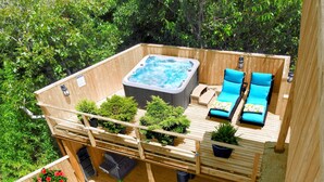 A rooftop deck with a hot tub, lounge chairs, and potted plants. - Immaculate Luxury Fire Island Pines Home, Gourmet Kitchen, Pool, Hot Tub Private (Fire Island Pines)