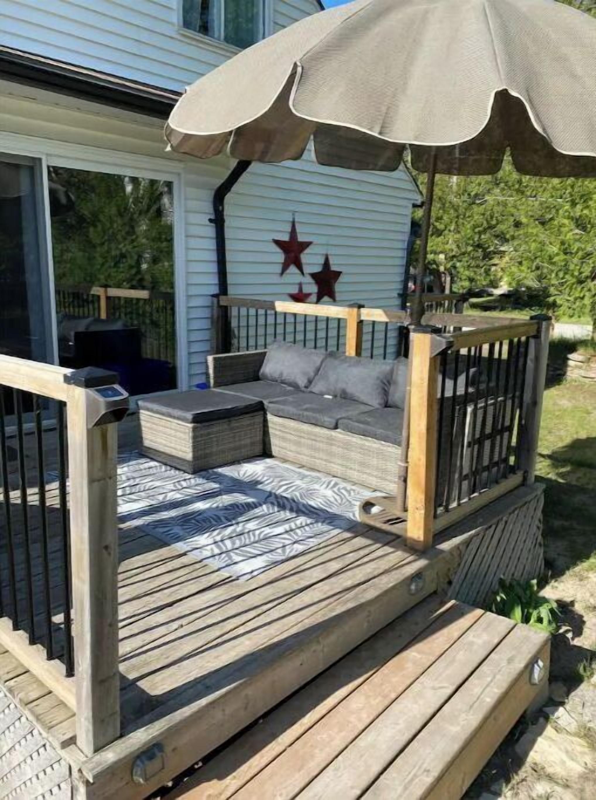 Side deck c/w outdoor sectional and umbrella.