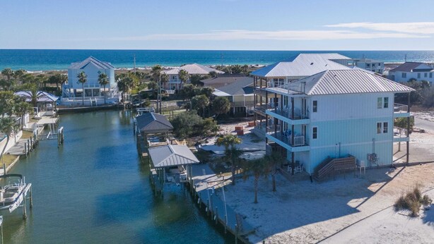 A coastal property with multiple buildings, docks, and a marina.
