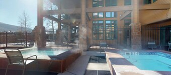 2-story condo with loft, balcony, indoor & outdoor pools, game room, gym, W/D