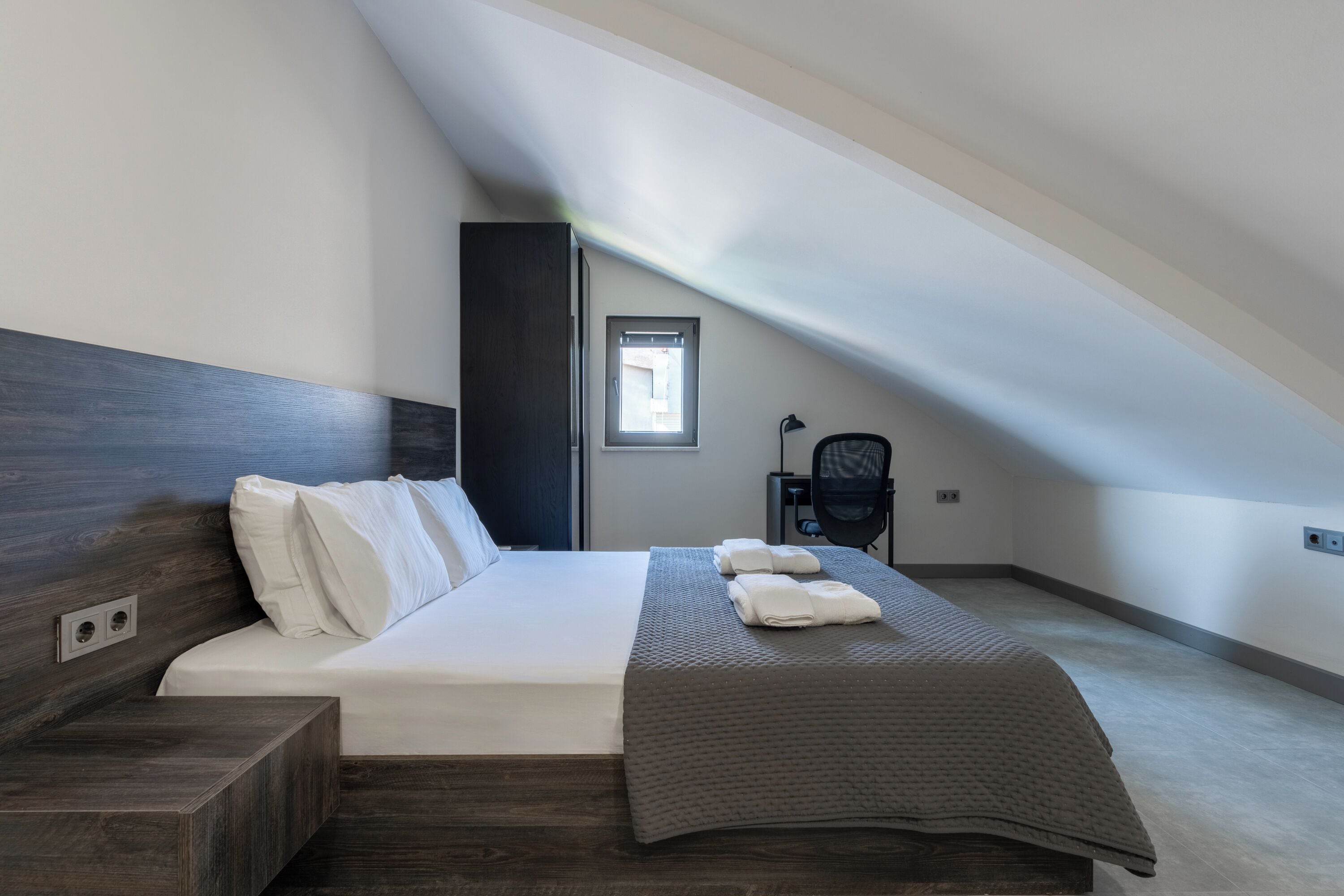 Premium bedding, desk, laptop workspace, blackout curtains