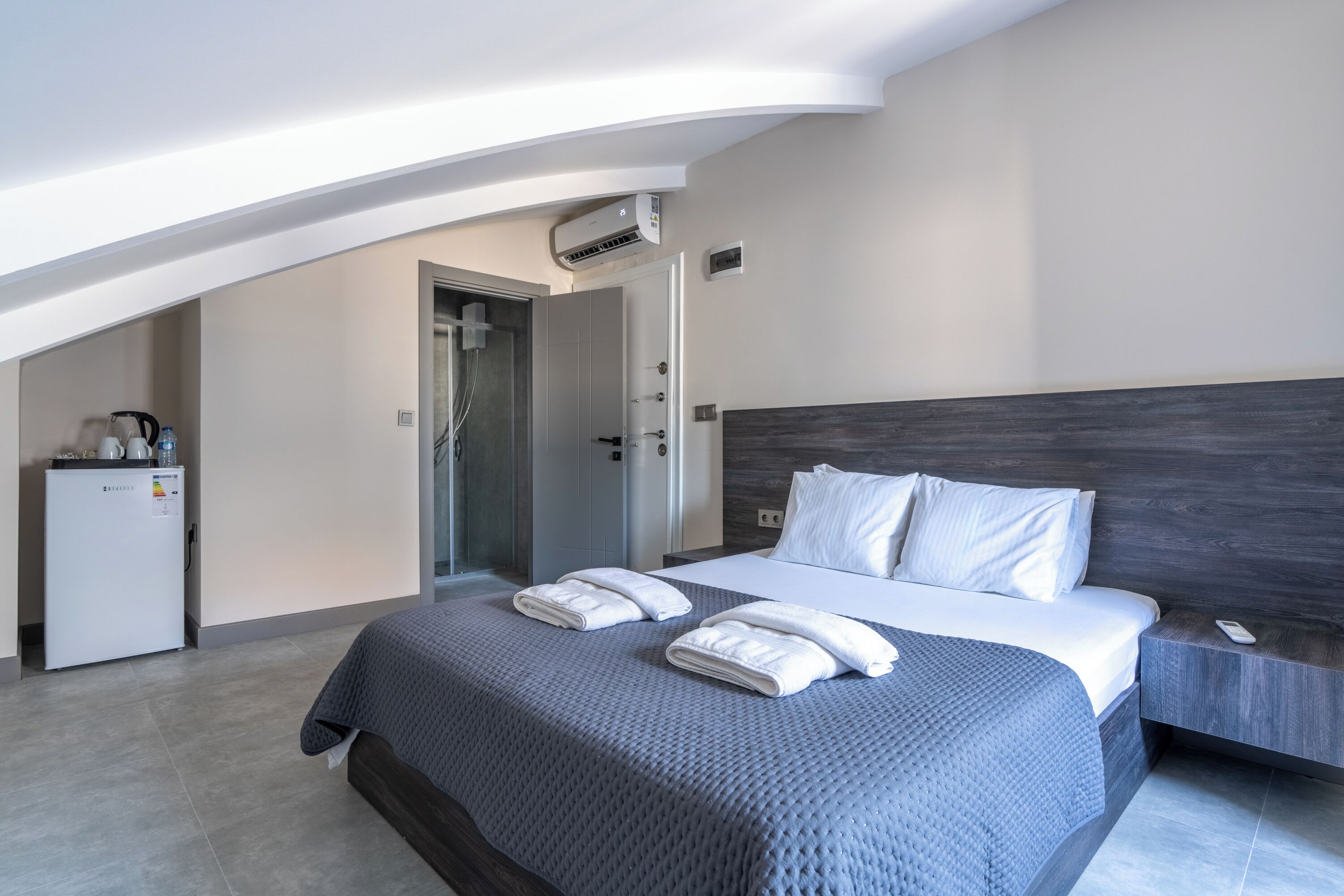 Premium bedding, desk, laptop workspace, blackout drapes