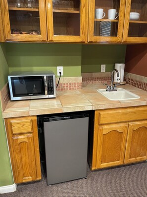 Fridge, microwave, coffee/tea maker, paper towels