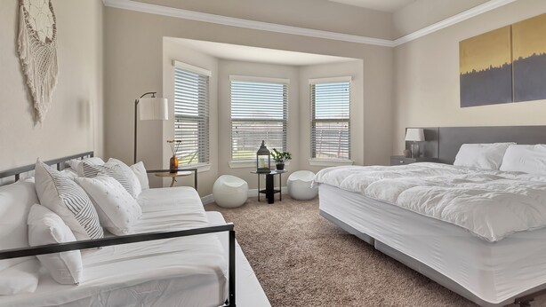 A bedroom with two beds, a large window, a wall-mounted macrame, and a cityscape painting. - Feel At Home in Richmond (Richmond)