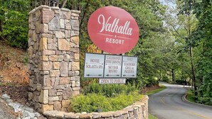A sign for Valhalla Resort with directions to hotel, spa, fine dining, and other amenities. - Golf View located in Valhalla Resort! Minutes to Oktoberfest! (Helen)