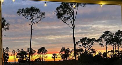 Enjoy sunset and an evening around firepit, short walk to beach and pool