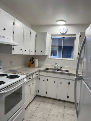 Fridge, microwave, oven, cookware/dishes/utensils