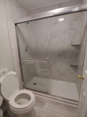 Shower, hair dryer, towels, toilet paper