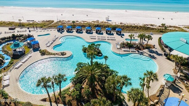 A resort with multiple swimming pools, beach access, and lounge areas. - Spacious 2BR condo in a premier beachfront resort. Your perfect getaway! (Panama City Beach)