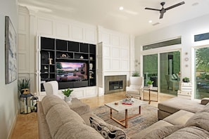 House | Living room | 65-inch Smart TV with satellite channels, fireplace, Netflix