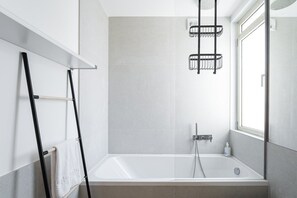 Bathtub, hair dryer, towels