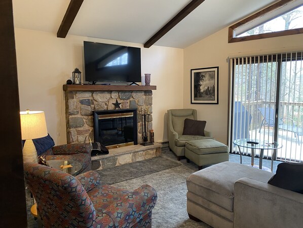 Smart TV, fireplace, books, printers