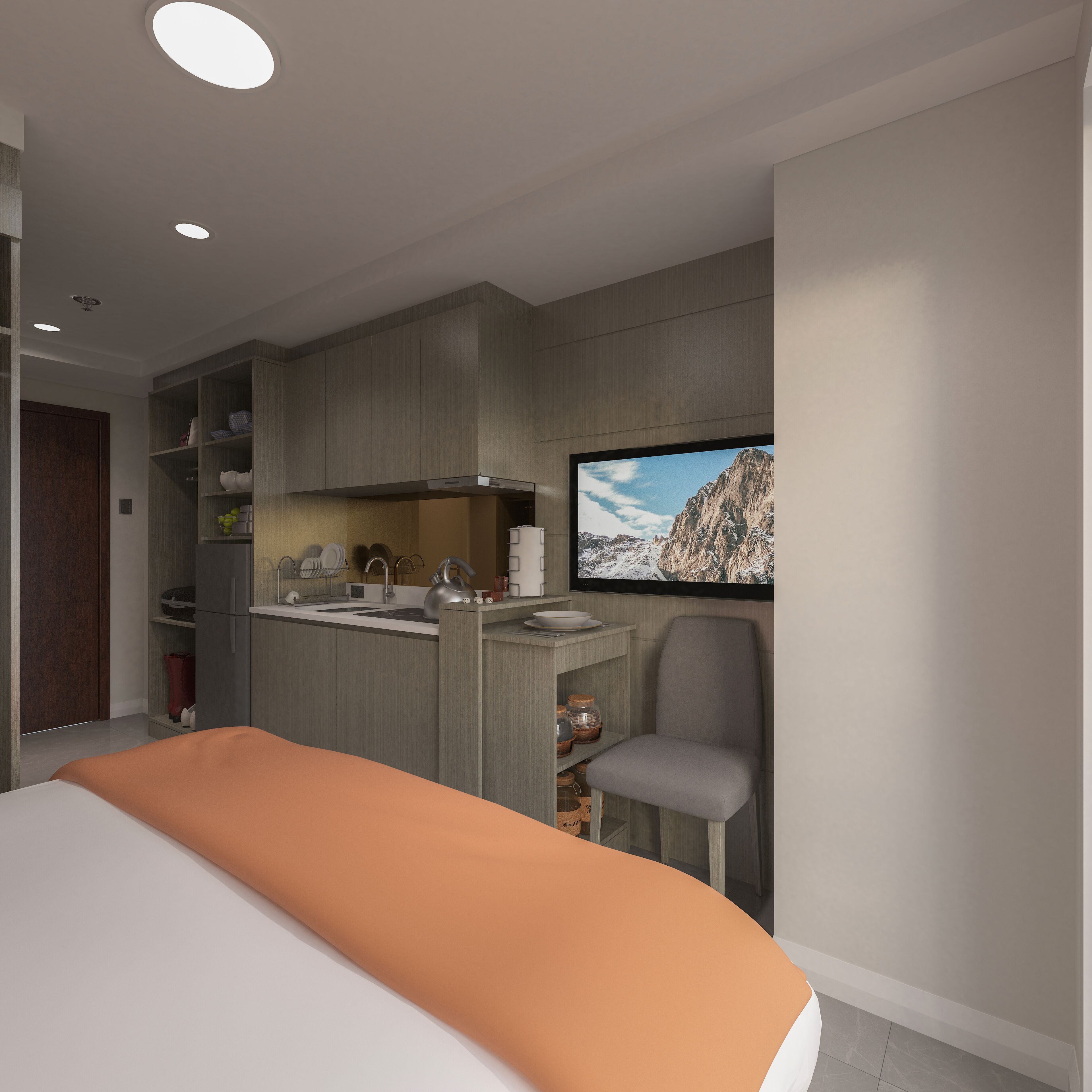 A modern bedroom with a bed, a small kitchenette, and a TV mounted on the wall.