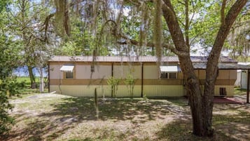 Situated in a serene rural setting, this charming home offers a peaceful retreat.