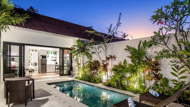 A modern house with a swimming pool, outdoor furniture, and lush greenery. - Villa Balik II Seminyak (Seminyak)
