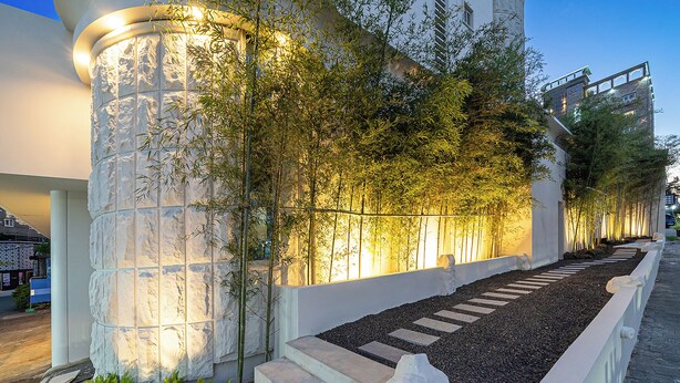 A modern building with a unique facade featuring a textured white wall and a series of steps leading up to a balcony. - Anook Hotel Daejeon Yongjeon Ⅱ (Daejeon)