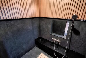 Deep soaking tub, designer toiletries, hair dryer, bathrobes