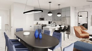 A modern kitchen with white cabinets, a central island, and pendant lighting. - Vor5469aa: 4 Bed, Whimsical Forest, Pool (Orlando)