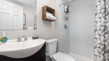 Bathtub, hair dryer, towels