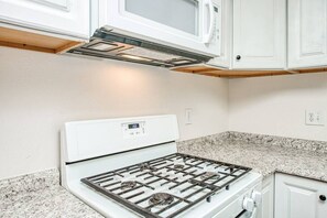 Fridge, oven, cookware/dishes/utensils, paper towels