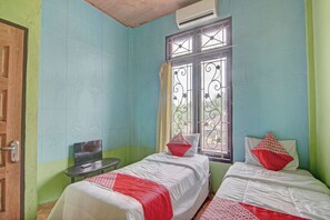 Habitación estándar con 2 camas individuales | Ropa de cama