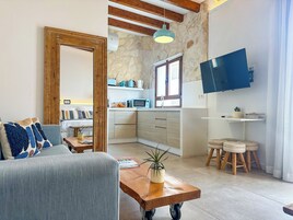 Deluxe Studio Suite | Living area | 30-inch Smart TV with digital channels