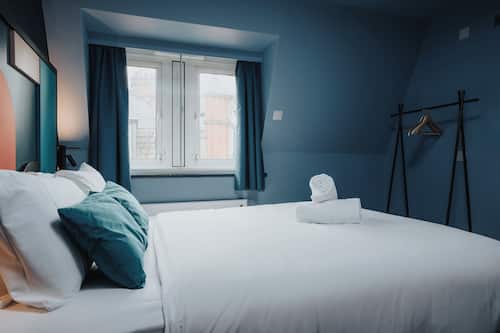 Desk, blackout drapes, bed sheets