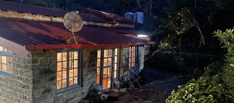 A heritage British bungalow beautifully restored as a homestay near Nainital.