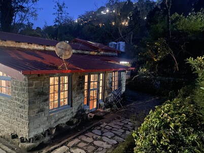 A heritage British bungalow beautifully restored as a homestay near Nainital.