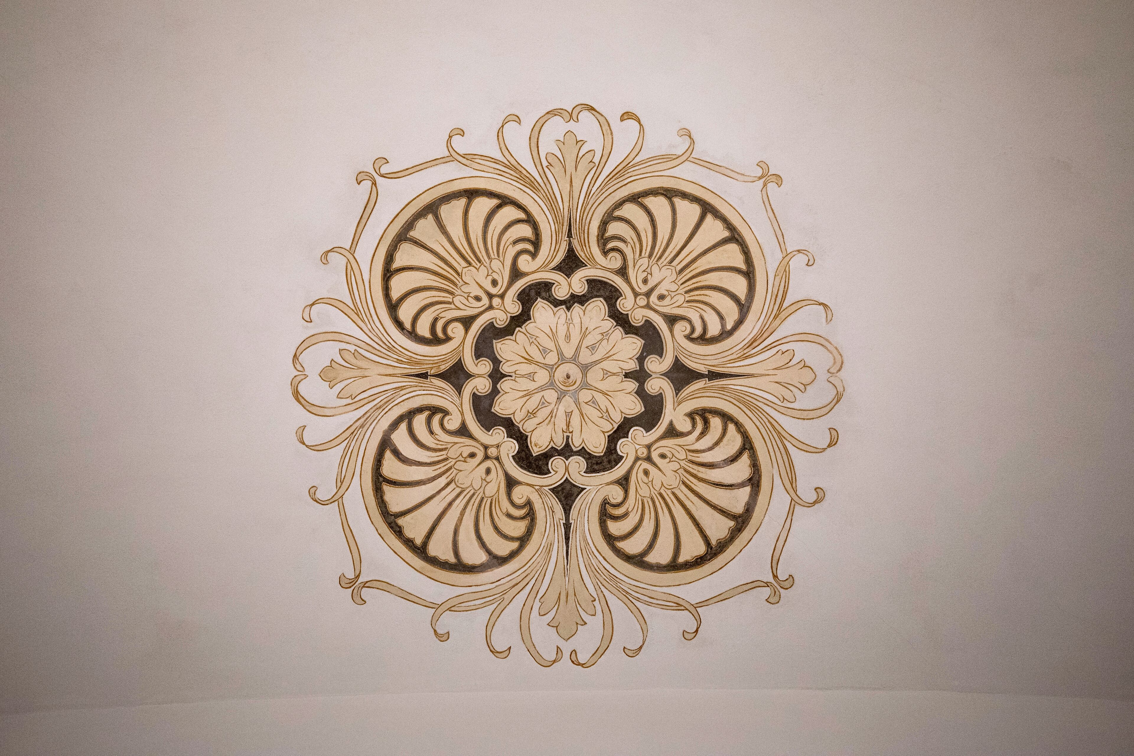 A symmetrical, ornate design on a plain background.