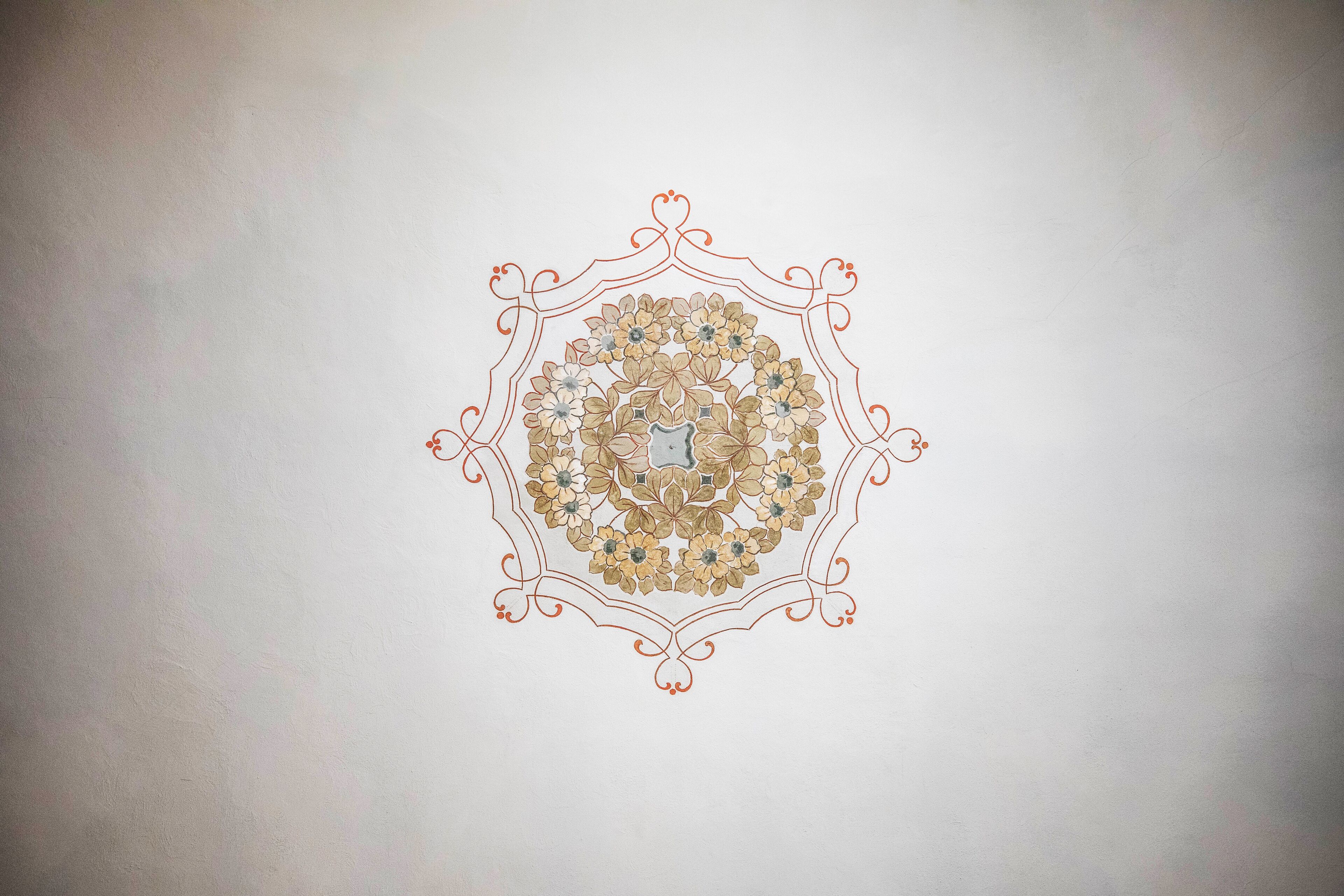 A detailed floral pattern on a wall.