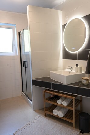 Shower, eco-friendly toiletries, hair dryer, towels