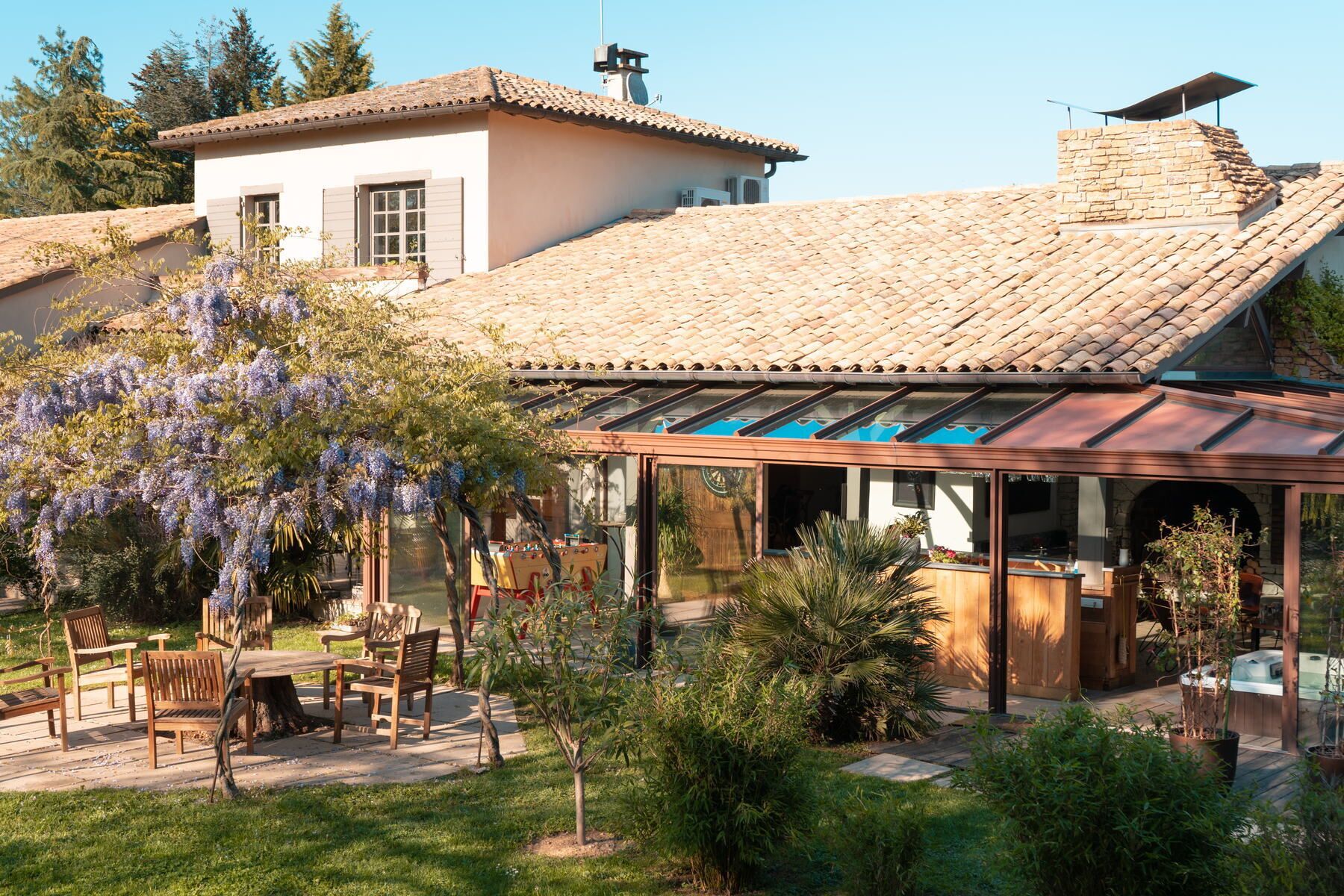 A patio area with outdoor seating and a pergola.