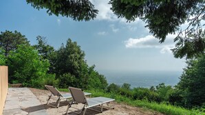 Two sun loungers on a stone patio overlooking a scenic view. - Locanda Di Alberi (Borgo San Lorenzo)
