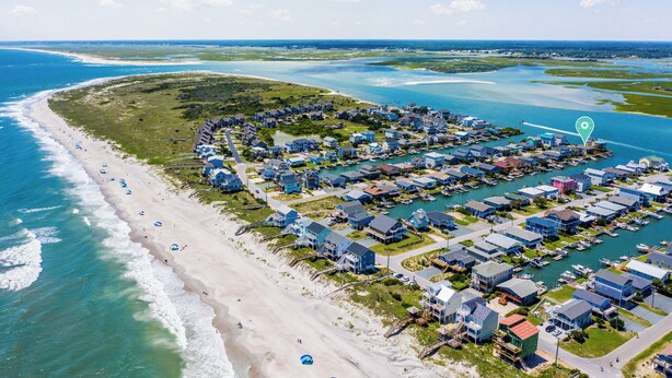 An aerial view of a coastal residential area with houses, a beach, and a marina. - Dream On #145 - Private boat dock, short walk to the beach, dog friendly! (Topsail Beach)
