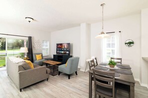 Townhome, Multiple Beds, Patio, Garden View (The Emerald Cove) | Living area | 42-inch flat-screen TV with digital channels - The Emerald Cove Best Spot in Kissimmee! (Kissimmee)