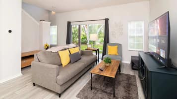 Townhome, Multiple Beds, Patio, Garden View (The Emerald Cove) | Living area | 42-inch flat-screen TV with digital channels