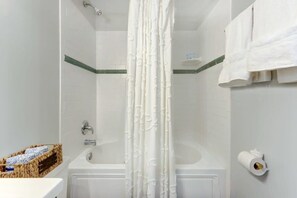 Bathtub, hair dryer, towels