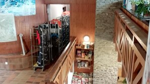 A multi-level interior with a wooden staircase, a bookcase, and a metal rack with bags. - Terrace, parking, tv, ski locker, 45m², Les Angles (Les Angles)