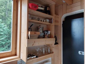 Effortlessly prepare meals in this well-equipped kitchen with a window for natural light and ample storage for kitchen essentials.