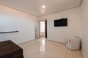 Premium Room | Living area | 32-inch Smart TV with digital channels