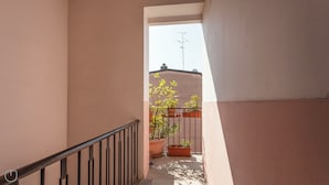 A narrow balcony with potted plants and a metal railing. - Italianway - Cristoforo Colombo 5B (Milan)
